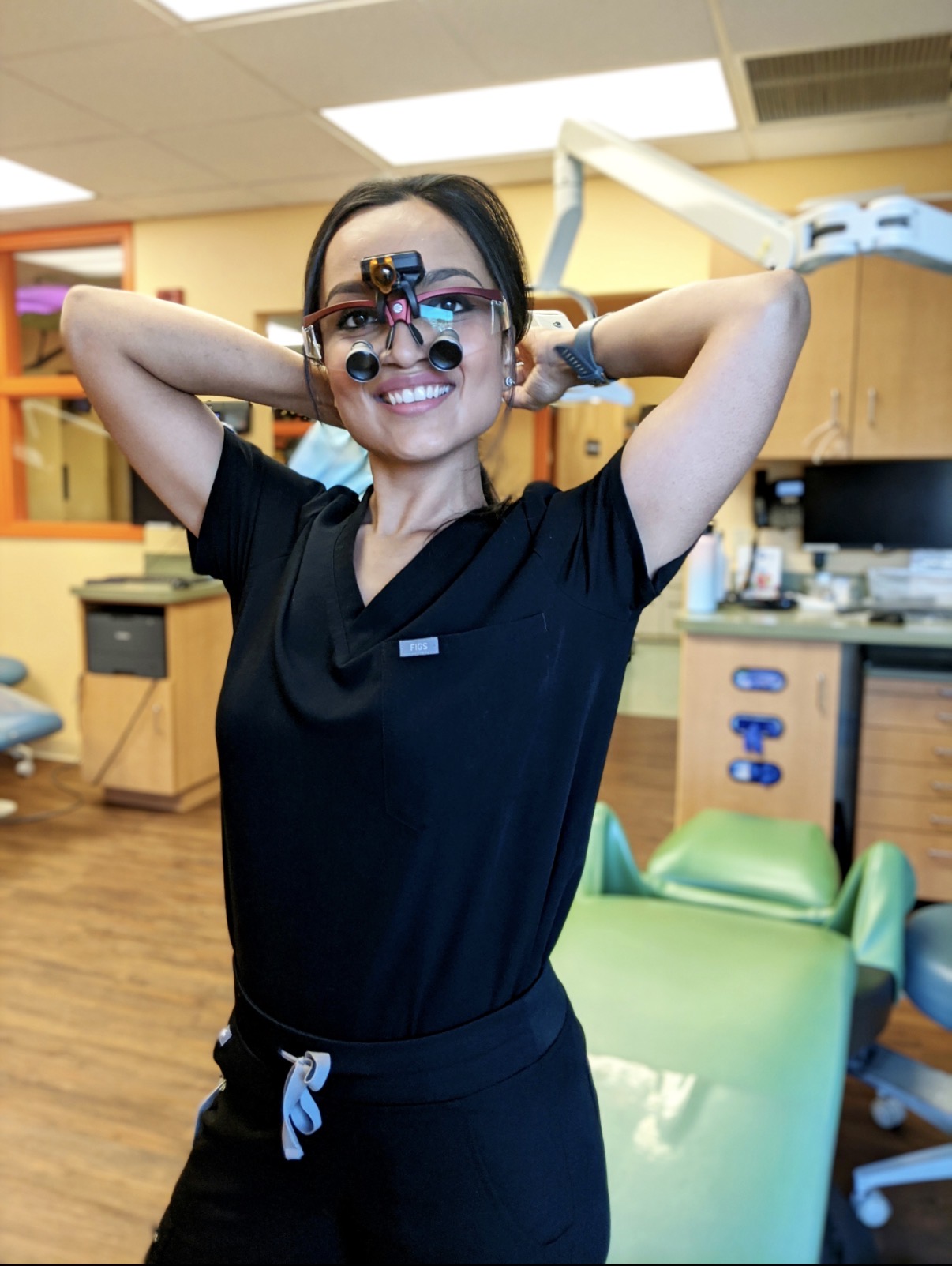 Dr. Nidhi smiling in clinic